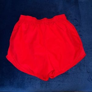 Red Nike short size small with panty liner